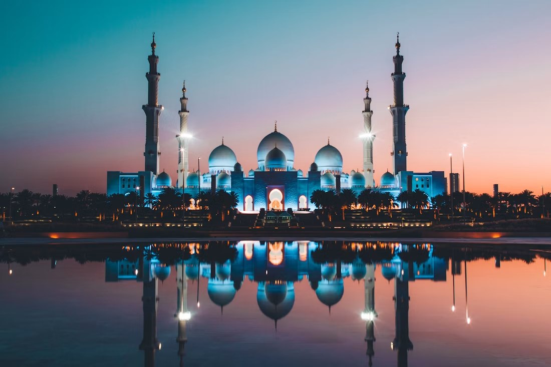 Sheikh Zayed Grand Mosque reflected at twilight